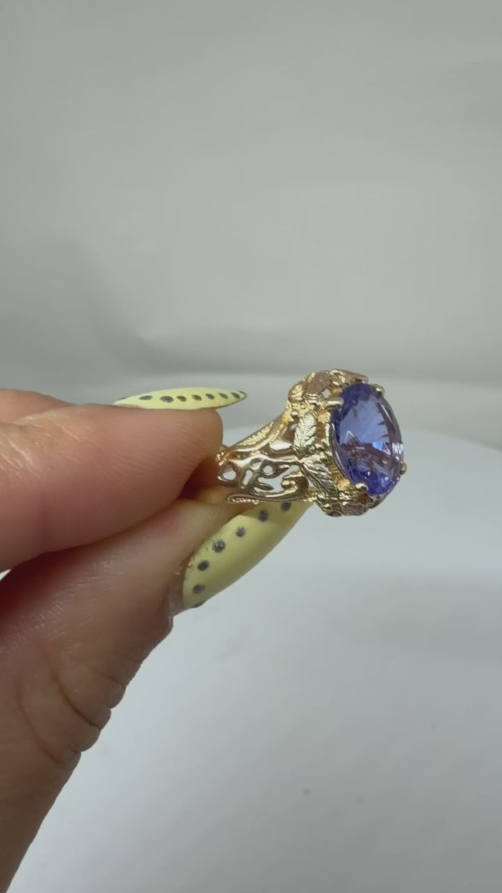 Tanzanite & two tone 10k gold size 7 ring